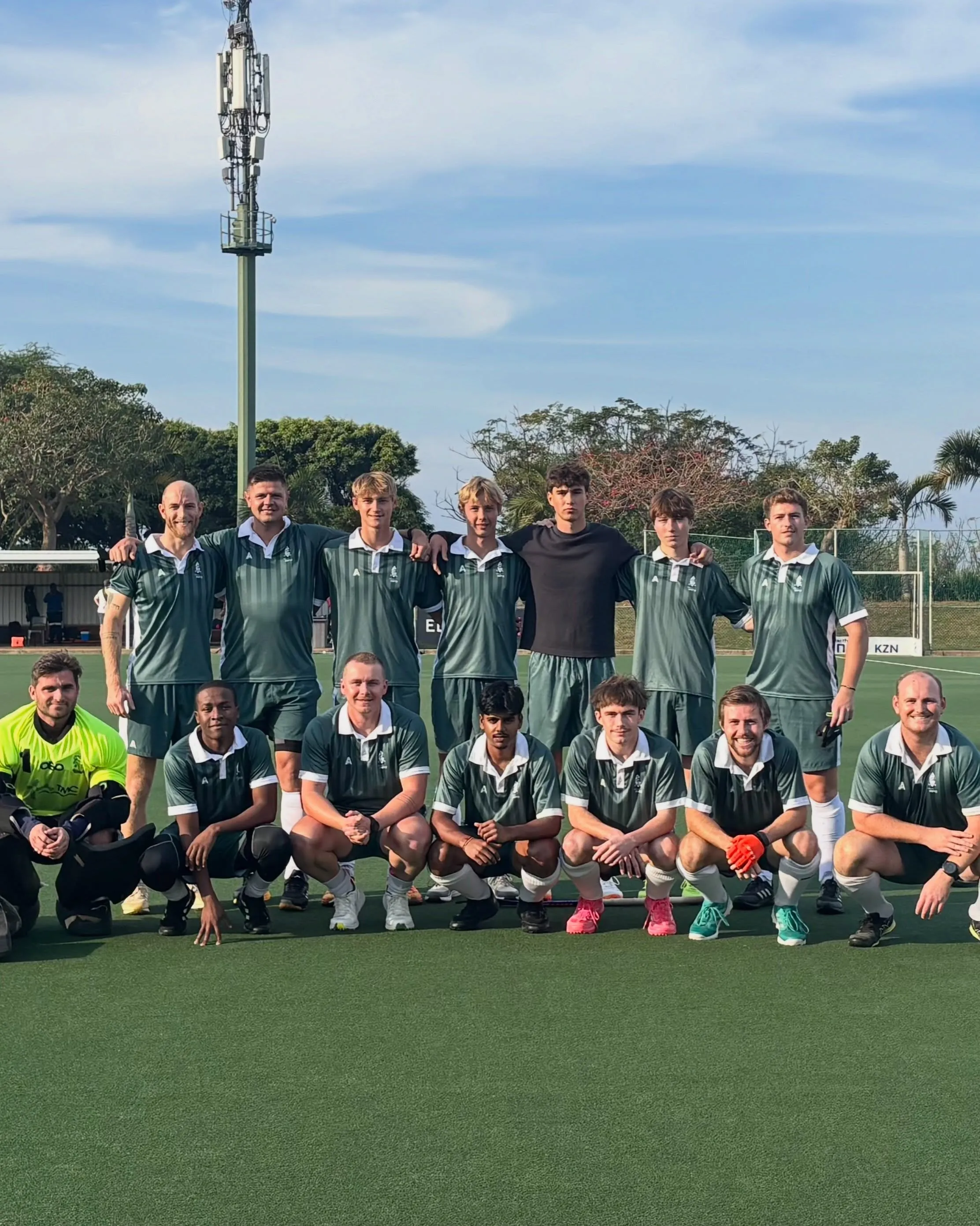 The Impis men's team lined up for a team photo in the green and white striped kit.